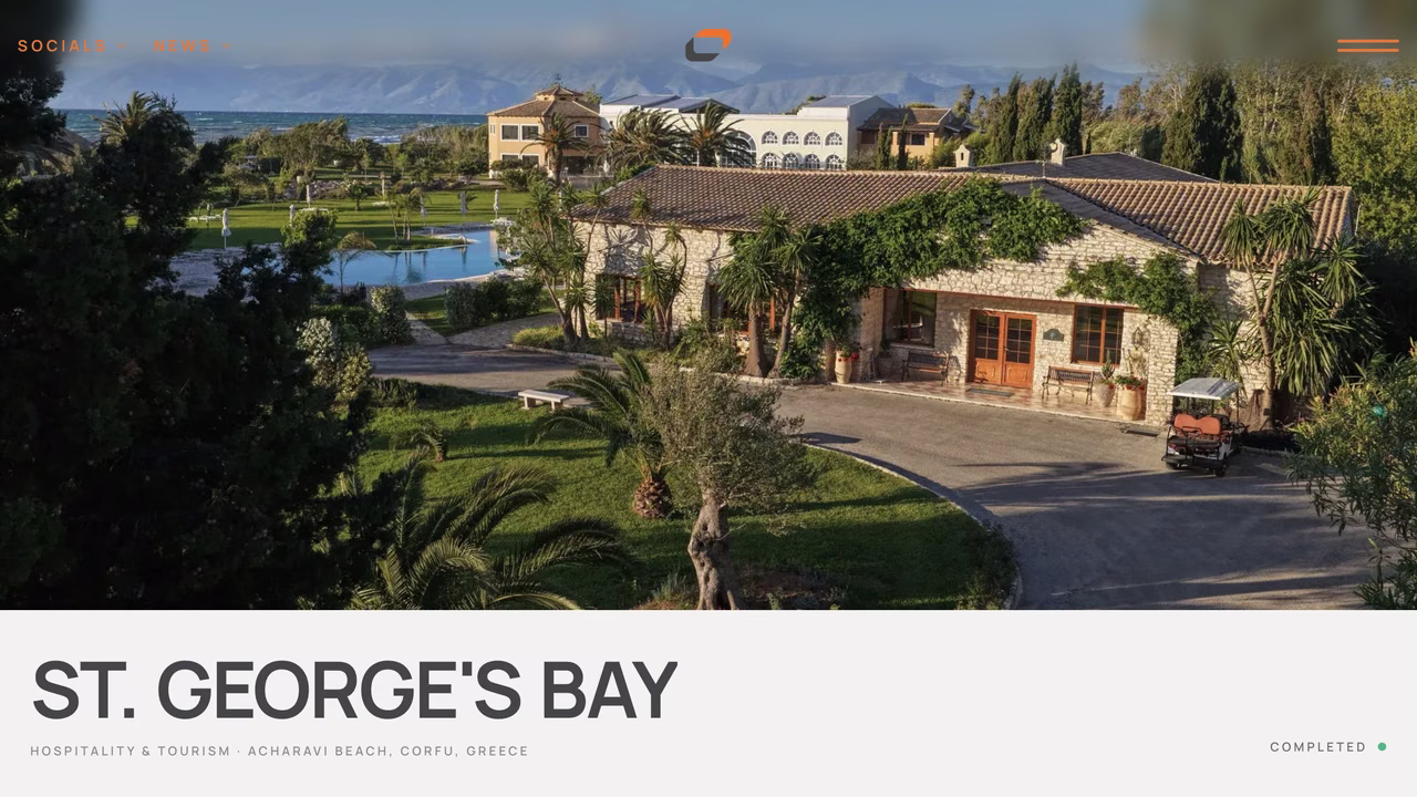 Concord Group project page for St. George's Bay, an aerial of a stone villa and gardens on the Corfu coast.