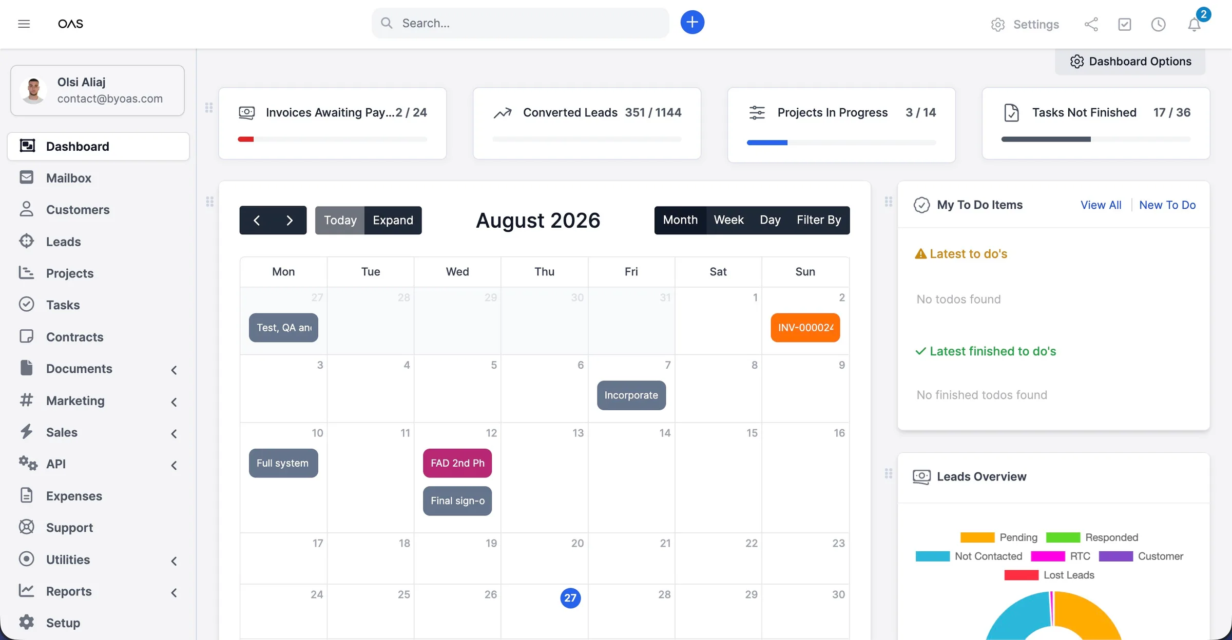 The OAS CRM dashboard: a month calendar of appointments and deadlines, counters for invoices awaiting payment, converted leads, projects in progress and open tasks, plus a to-do list and leads breakdown.